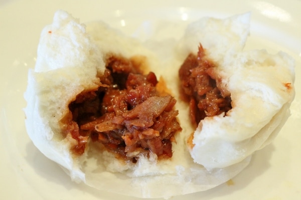 cross-section of a steamed Chinese bun filled with barbecue pork