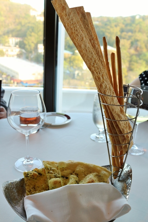 a bread basket with various types of bread