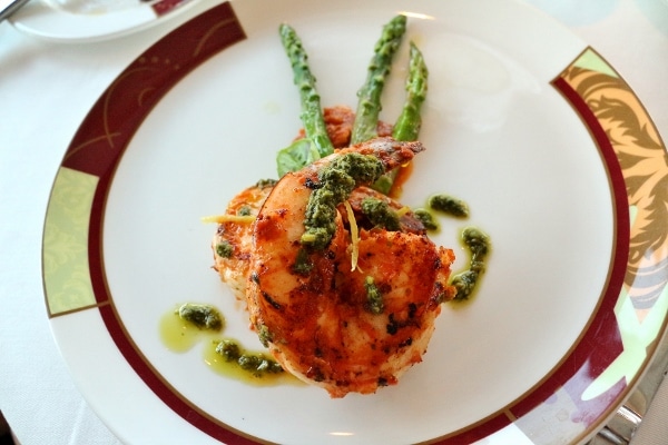 jumbo shrimp with pesto on a white plate