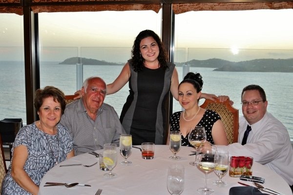 A group of people sitting at a table in a restaurant