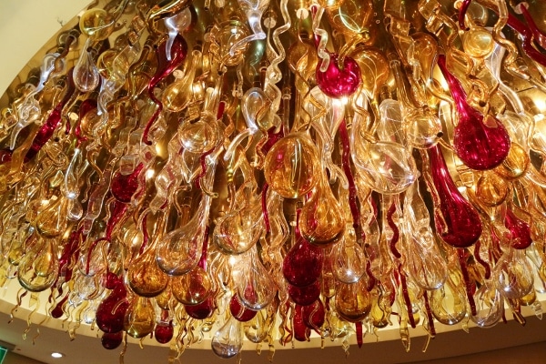 a colorful glass chandelier hanging from the ceiling