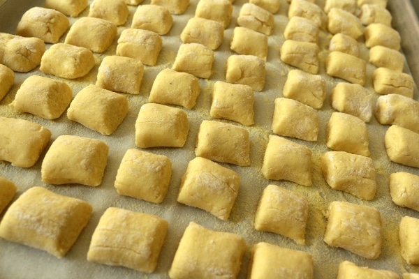 rows of cut gnocchi arranged on a baking sheet