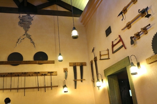 saws and other tools hanging from walls as decorations