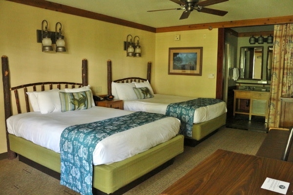 a hotel room with two queen beds