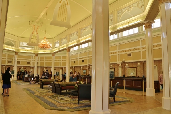 a grand hotel lobby with various sitting areas