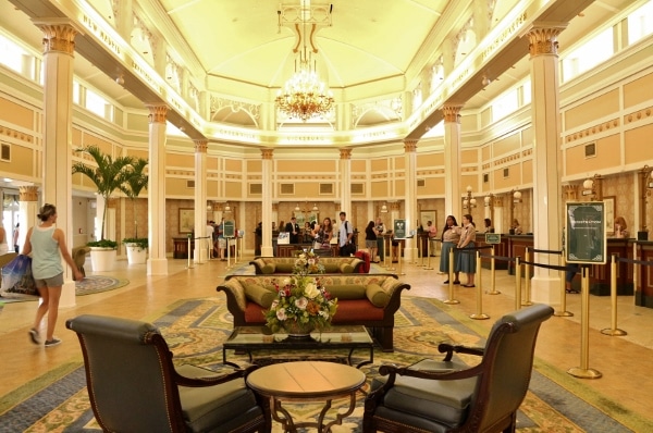 elegant sitting areas inside a large hotel lobby with warm lights