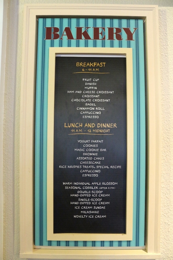 A closeup of a menu on a wall