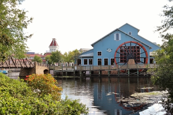 a blue building across a small river