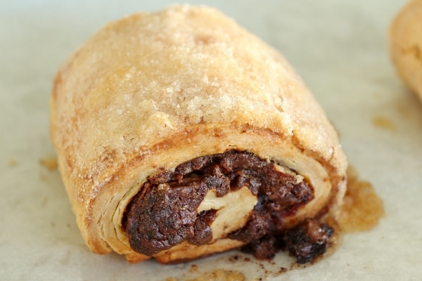 A close up of a rugelach pastry with date and chocolate filling