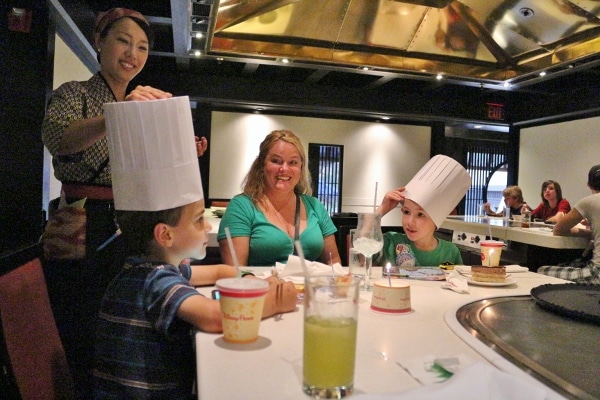 A group of people sitting at a table in a restaurant