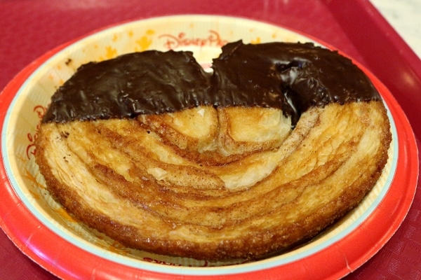 a flaky palmier dipped in chocolate