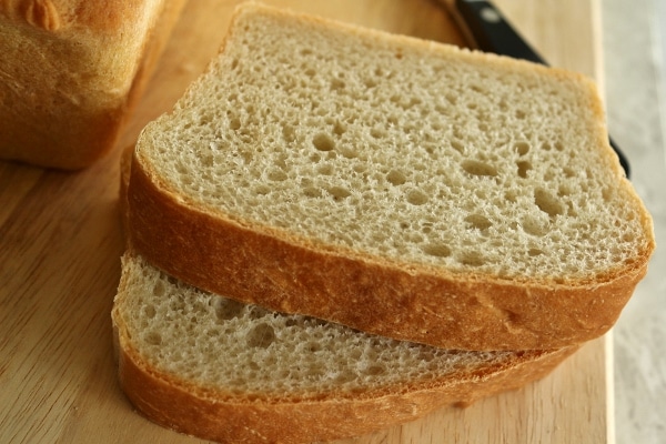 a closeup of sliced bread on a wooden board