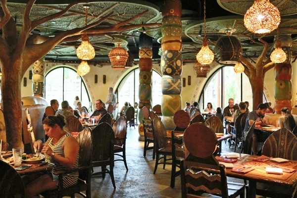 interior of a restaurant with colorful columns and funky lighting fixtures