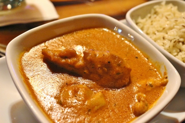 A closeup of a bowl of butter chicken