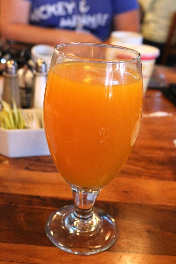 A glass of juice on a table