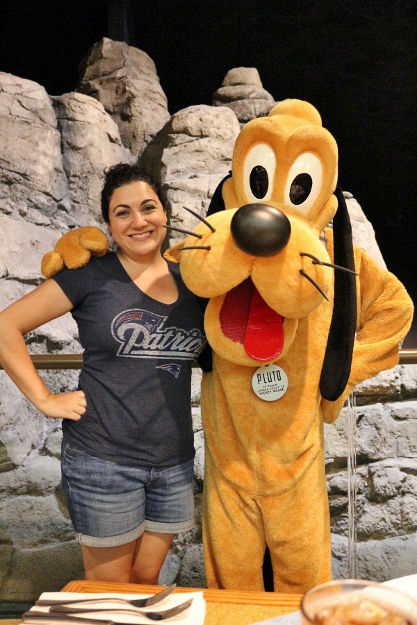 a woman posing with Pluto