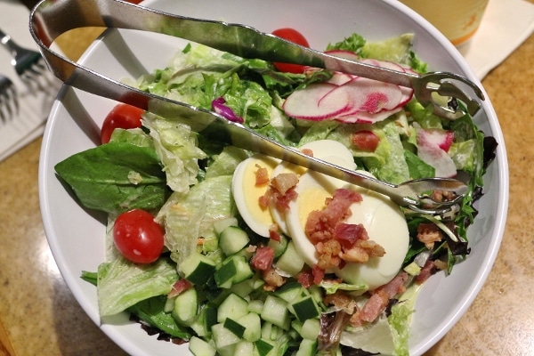 A bowl of salad with hard-boiled eggs