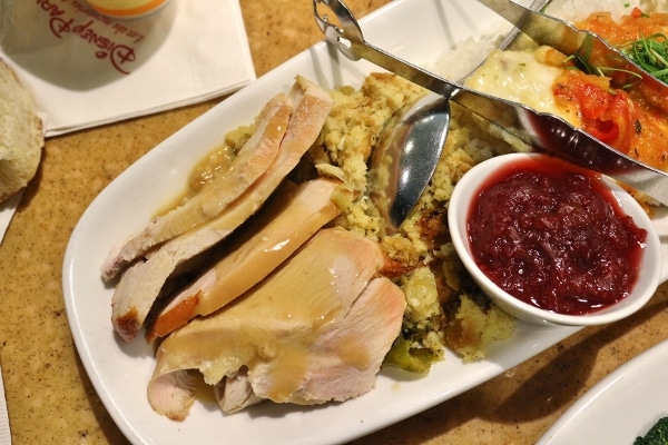 roasted turkey with gravy, stuffing, and cranberry sauce