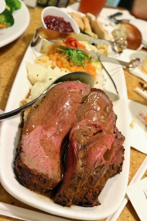 a closeup of roasted beef filet on a long platter