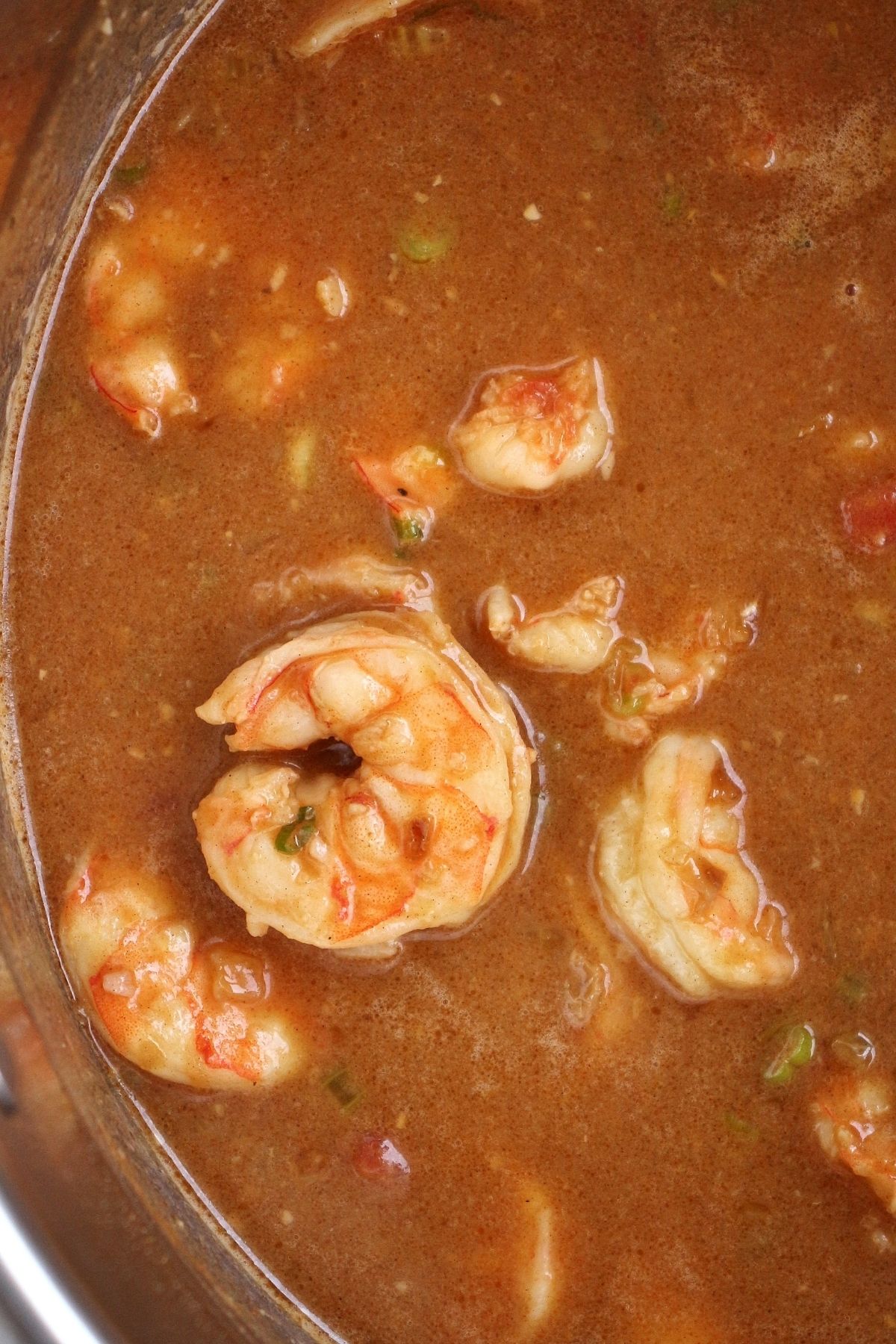 overhead view of a pot of shrimp in a thick creamy stew