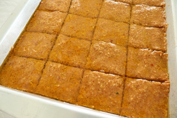 A tray of sini kofte ready to bake