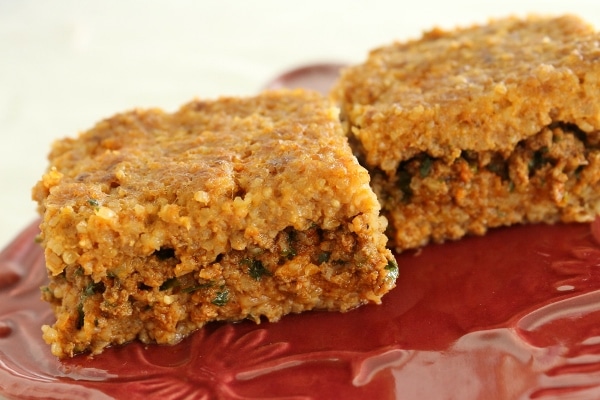 Two pieces of sini kofte on a plate