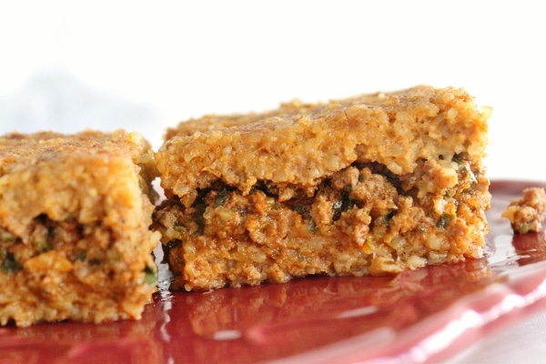 Two pieces of sini kofte on a plate