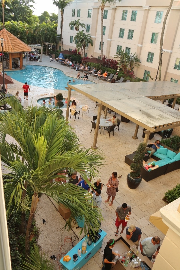 overhead view of people congregating outside a hotel pool