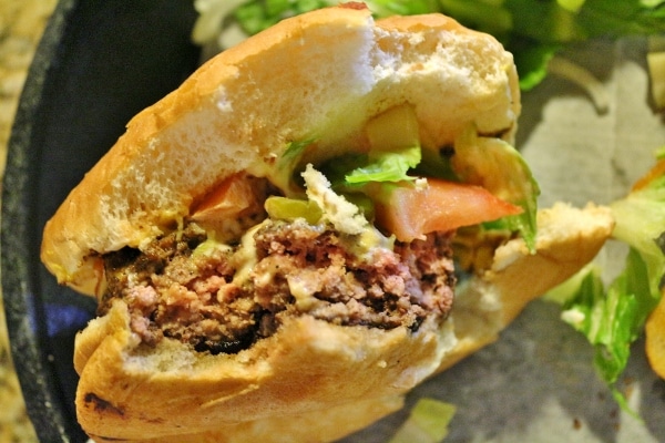 A close up of a half-eaten cheeseburger