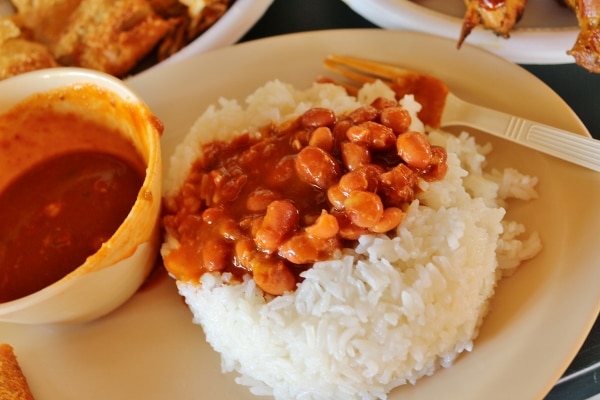 white rice topped with stewed beans