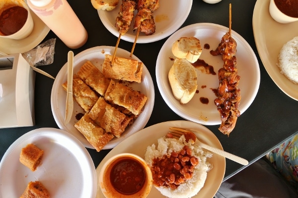 overhead view of a table covered with plates of Puerto Rican food