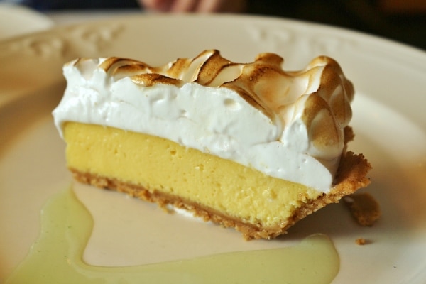 a slice of key lime pie with meringue on top