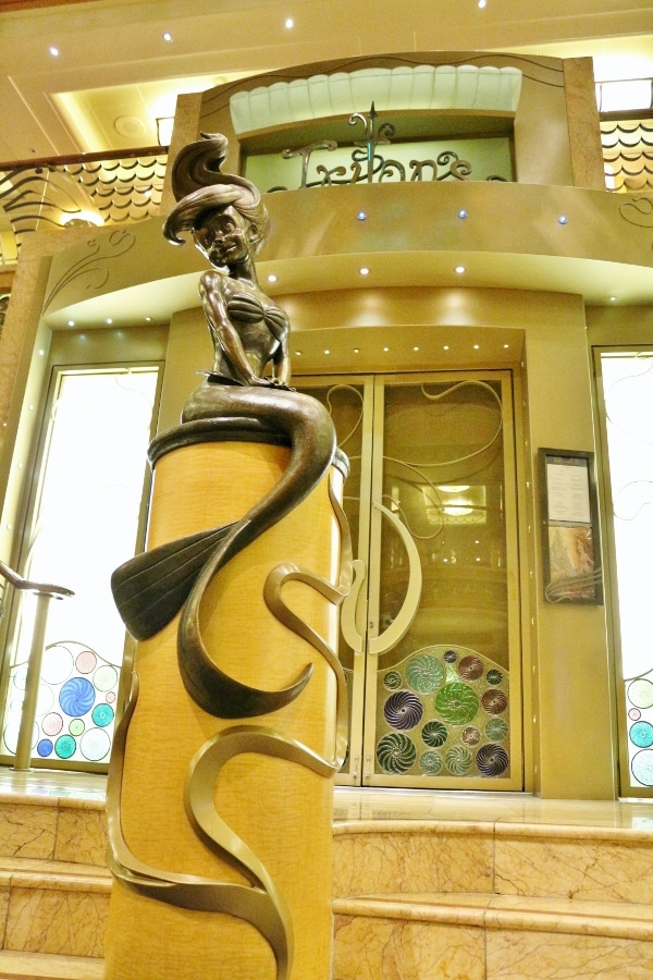 Ariel statue inside the lobby atrium of the Disney Wonder cruise ship