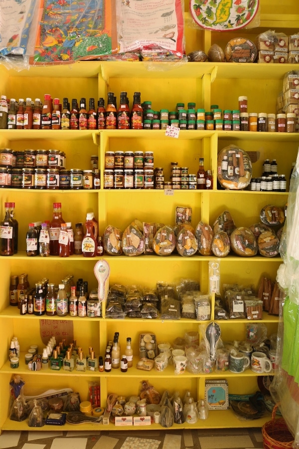 shelves of spices for sale in a shop