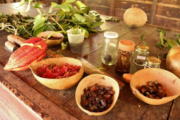 a variety of spices laid out on a wooden table