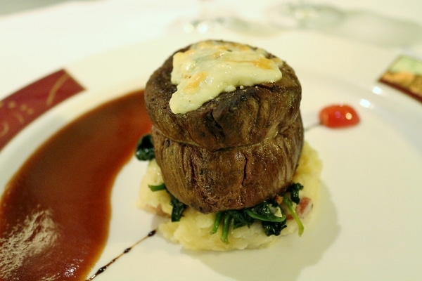 A close up of a filet mignon with blue cheese on top