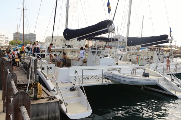 A catamaran docked in the water