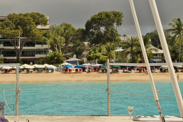 view of a Caribbean beach from a catamaran