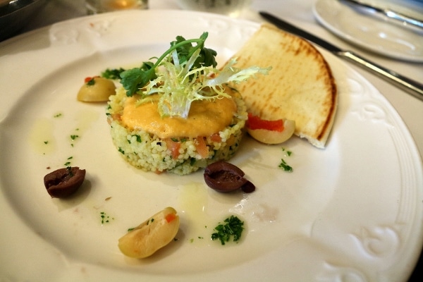 a meze plate with pita bread and hummus