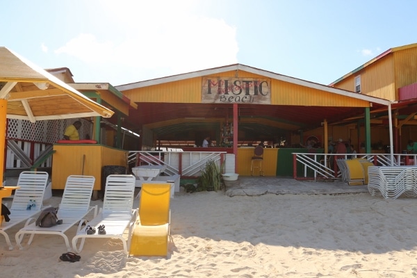 view looking toward a yellow building on a beach