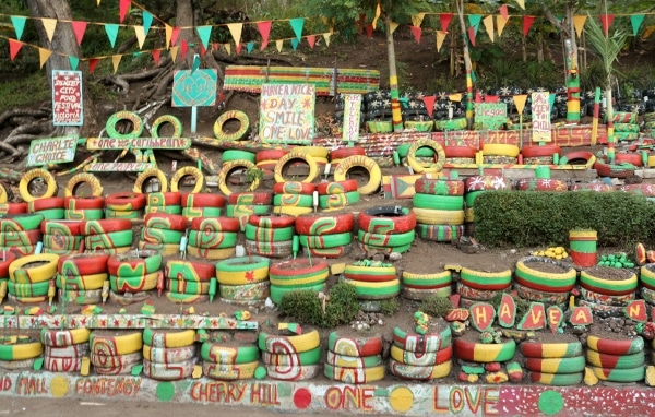 stacks of tires painted red, green and yellow