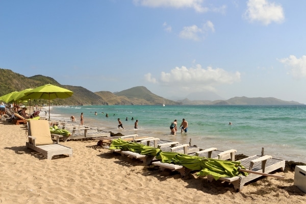 A group of people sitting at a beach