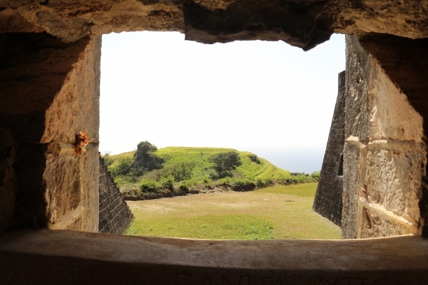 view through an opening in a stone fortress