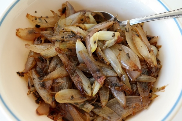 a bowl of sauteed shallots