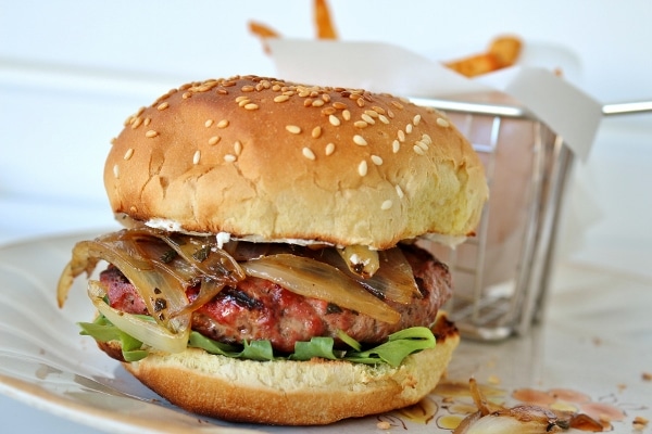 A close up of a burger on a plate