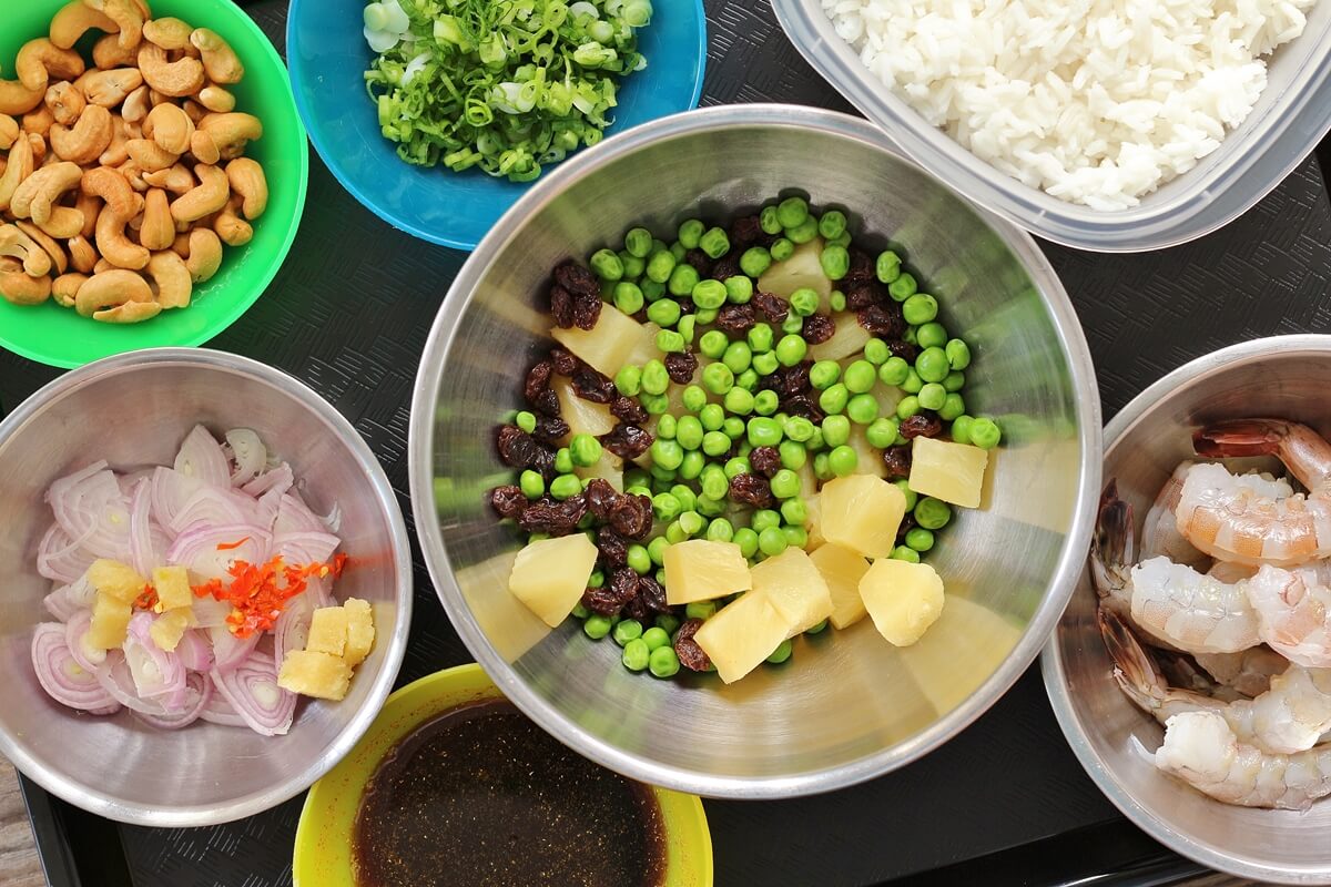 bowls of ingredients for Thai pineapple fried rice with shrimp