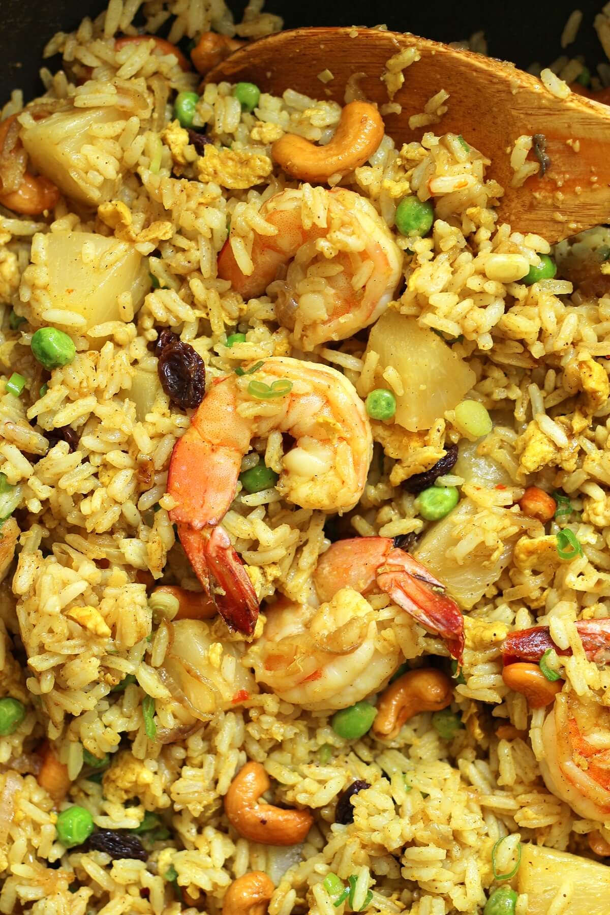 overhead view of pineapple fried rice with shrimp in a wok