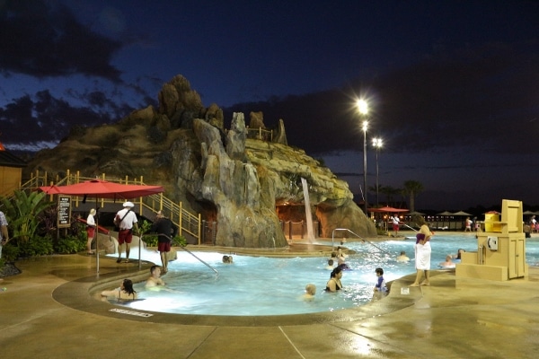 A view of a large swimming pool at night