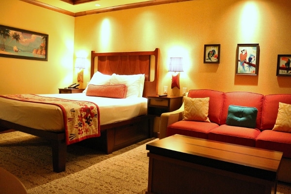 A hotel bedroom with a bed sitting area from another angle