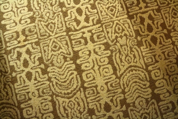 A close up of tiki style carpeting on the floor